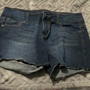 Dark wash jean shorts.